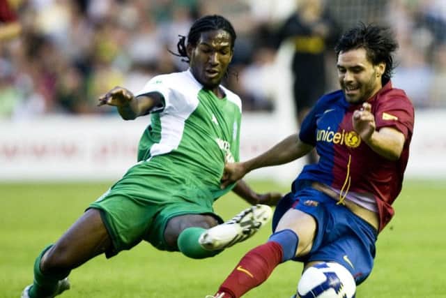 Thicot, left, contests for the ball with Barcelona's David Corcoles as he played as a trialist for Hibs