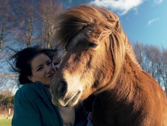 Shirley Reise with her family's chestnut Shetland Pony, Winnie