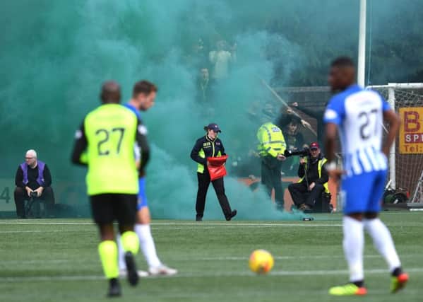 Kilmarnock take on Celtic as stewards deal with smoke bombs. UEFA fines clubs in European competitions through strict liability if their fans use pyrotechnics. Picture: SNS Group