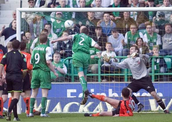 Gary Smith heads home Hibs' winning goal in a thrilling 3-2 contest