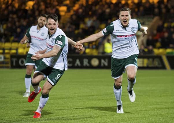 Paul Hanlon, right, celebrates with Marc McNulty after opening the scoring for Hibs
