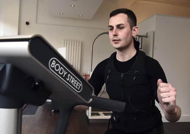 Evening News journalist Kieran Murray is put through his paces at Bodystreet, an innovative workout studio that combines personal training with Electrical Muscle Stimulation. Pic: Lisa Ferguson