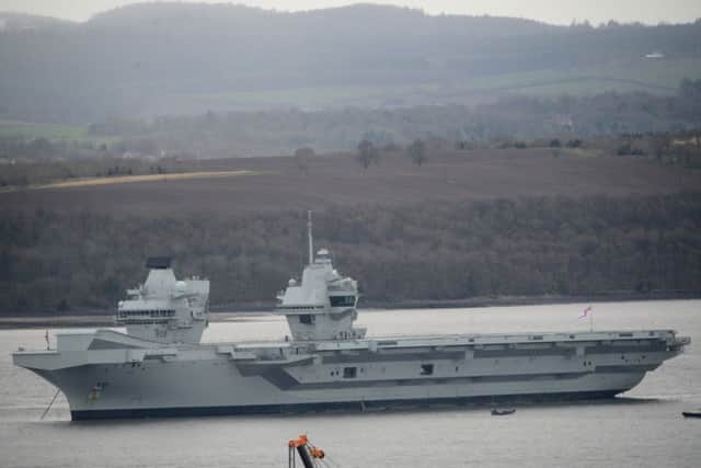 The HMS Queen Elizabeth Aircraft carrier sits in Firth of Forth as it returns to Rosyth Dockyard for scheduled maintenance and for the first time since it was launched.