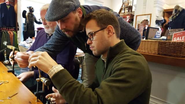 Lee Currie (standing teaching fly-tying during one of the free sessions held at Orvis in Edinburgh. Picture: Nigel Duncan