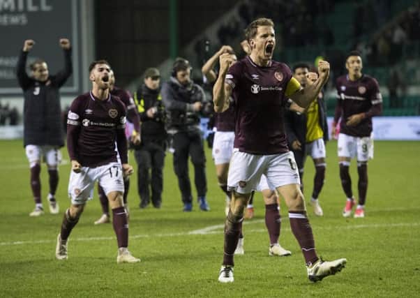 Christophe Berra celebrates Hearts' victory over Hibs in December. Pic: SNS