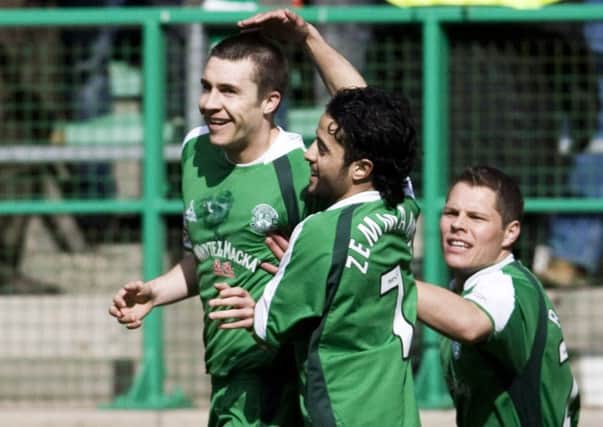 Colin Nish celebrates with fellow goalscorer Merouane Zemmama, and John Rankin