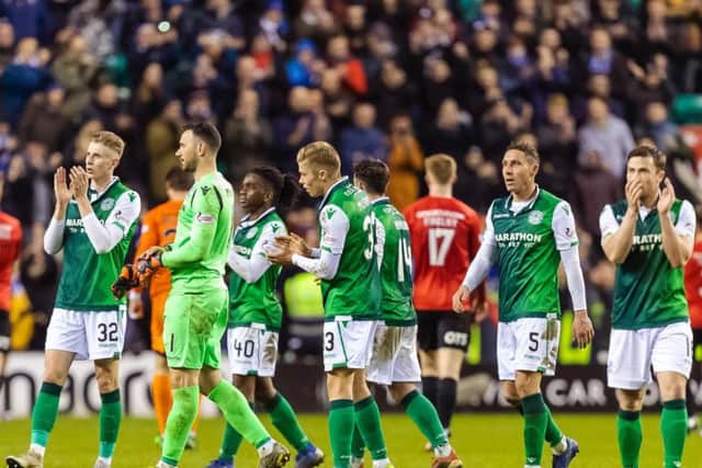 Hibs' players applaud the fans at full-time after the Kilmarnock match. Pic: SNS