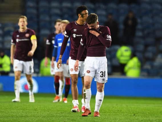 Substitute Bobby Burns trudges off the Ibrox pitch following another defeat in Glasgow. Pic: SNS