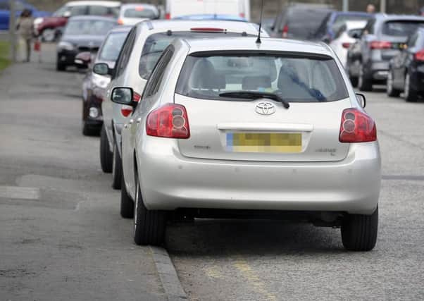 Parking on pavements will be permitted in certain circumstances under the proposed new law (Picture: Neil Hannah)