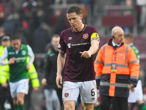 A dejected Christophe Berra walks off the park at full-time.