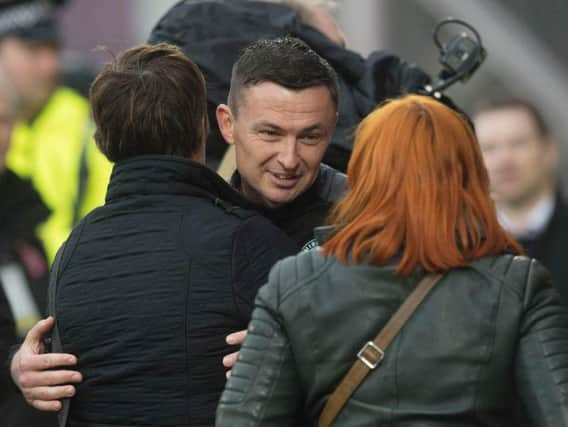 Hibs head coach Paul Heckingbottom is congratulated by chief executive Leeann Dempster after defeating Hearts. Pic: SNS