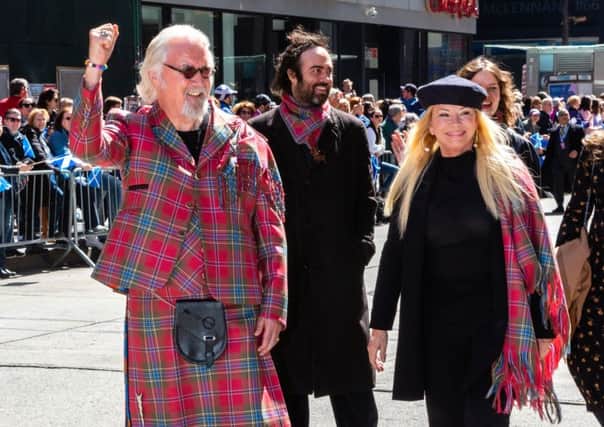 Billy Connolly leads the Tartan Day Parade with his wife, Pamela Stephenson. Picture: Benjamin Chateauvert/PA