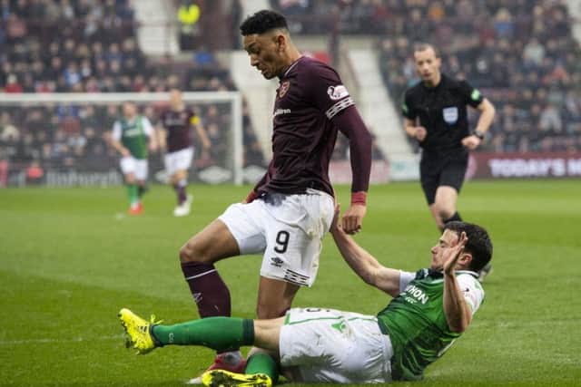 Lewis Stevenson tackles Hearts midfielder Sean Clare during Saturday's win at Tynecastle
