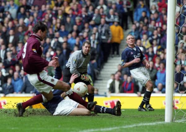 Stephane Adam scores late on for Hearts against Falkirk in the 1998 Scottish Cup semi-final. Pic: SNS