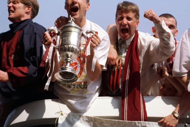 HEARTS HEAD TO TYNCASTLE- 17/5/98- Hearts players on route to Tyncastle in their open top bus.   L-R:  Gary Locke, Paul Ritchie and John Robertson.