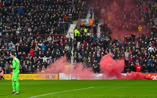 A flare is let off during the Edinburgh derby. Picture: SNS