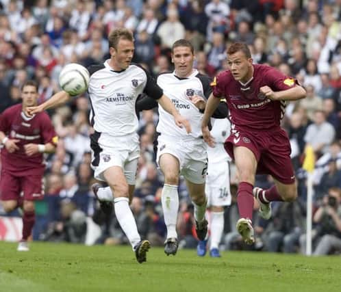 13/05/06 TENNENT'S SCOTTISH CUP FINAL
HEARTS v GRETNA (1-1 AET 4-2 ON PENS)
HAMPDEN - GLASGOW
Ryan McGuffie and Hearts' Roman Bedner (right) compete for the ball