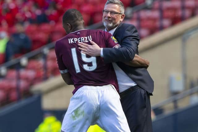Hearts' Uche Ikpeazu celebrates with manager Craig Levein after opening the scoring. Pic: SNS/Alan Harvey