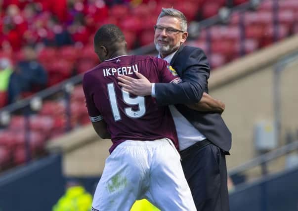 Hearts' Uche Ikpeazu celebrates with manager Craig Levein after opening the scoring. Pic: SNS/Alan Harvey