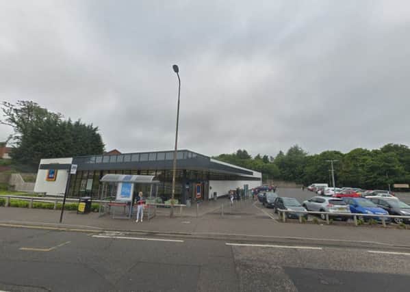 The reported stabbing took place outside Aldi on Gilmerton Road, Edinburgh.