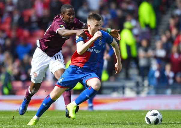 Hearts star Arnaud Djoum, left, battles with with Liam Polworth during the William Hill Scottish Cup semi-final
