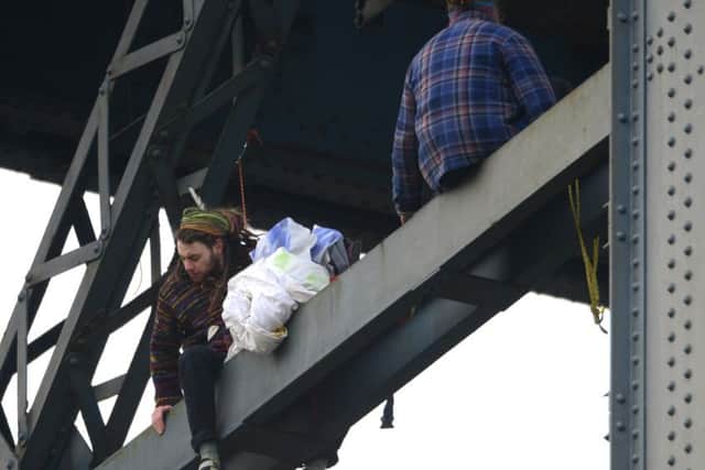 Four climate change protesters from Extinction Rebellion climbing the Finnieston Crane, Glasgow.
