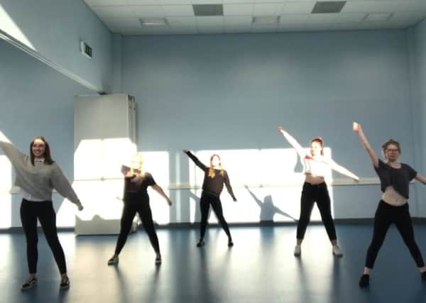 The pupils rehearsing for the show.