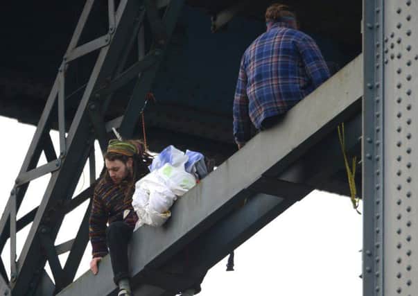 Four climate change protesters from Extinction Rebellion climbing the Finnieston Crane, Glasgow.