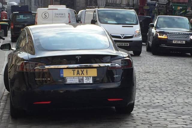 The Tesla with the personlised plate seen in the High Street, Edinburgh