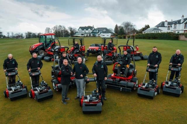 Bruntsfield Links Golfing Society CEO Dougie Cleeton seals a £250,000 Toro equipment deal with Stuart Tait of Reesink Turfcare, while course manager Neil Hogg and his team look on.