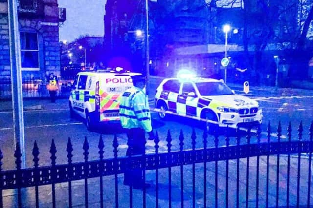 Officers in attendance on Chester Street in the West End following the shooting. Picture: Alasdair Morton
