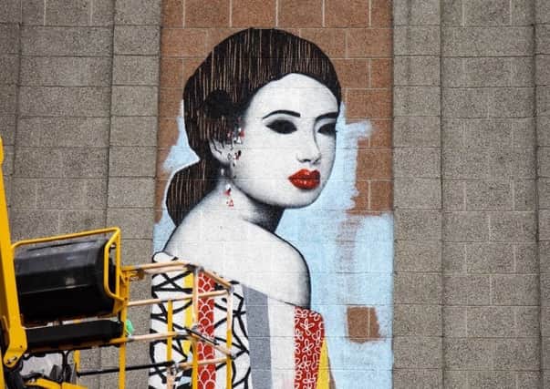UK street artist Hush has transformed the Aberdeen branch of John Lewis with his signature style. PIC: Louise Kendal/Contributed.