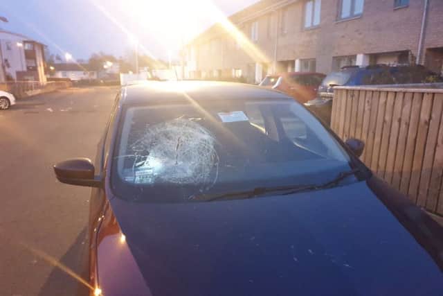 Mr Khan's windscreen was smashed