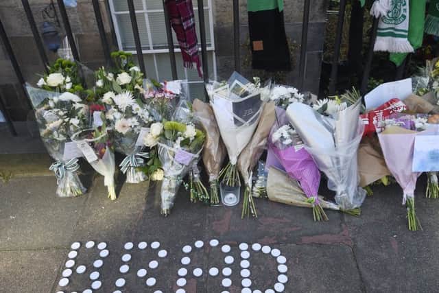 Floral tributes have been left near the scene where Bradley Welsh was shot and killed on Wednesday evening on Chester Street. Picture: Greg Macvean