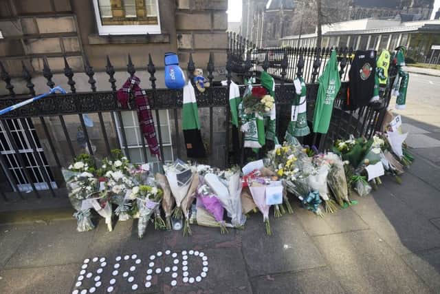 Floral tributes and Hibs scarves were left near the scene where Bradley Welsh was shot and killed on Chester Street. Picture: Greg Macvean