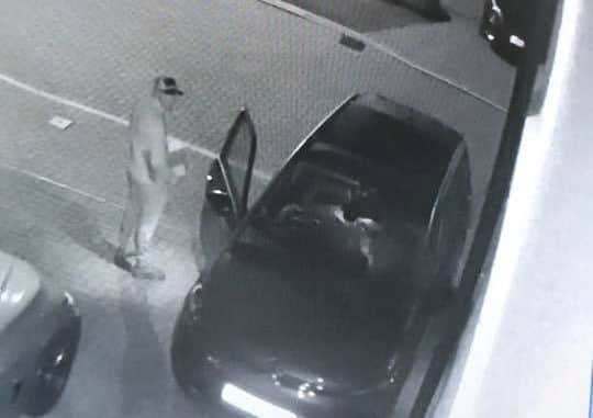 CCTV shows the thieves entering the vehicle.