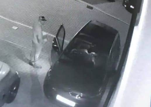 CCTV stills show the two thieves targeting the vehicle. Pic: Contributed.