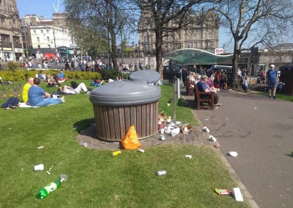 Litter strewn around bins in Princes Street Gardens
