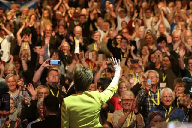Nicola Sturgeon waves to delegates after her speech during the SNP spring conference at the EICC. Picture: PA