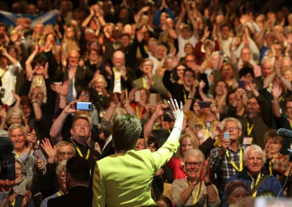 Nicola Sturgeon waves to delegates after her speech during the SNP spring conference at the EICC. Picture: PA