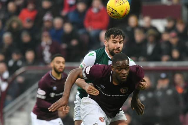 Darren McGregor grapples with Hearts star Uche Ikpeazu