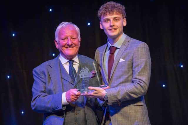 Jack Brodie receives his Inspirational Young Adult award in 2018