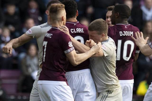 Hearts and Aberdeen players had a tussle during the latter's 2-1 win at Tynecastle recently. Picture: SNS