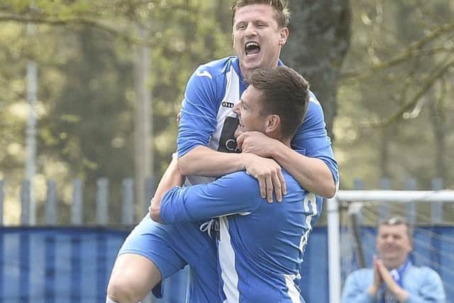 Penicuik striker Wayne McIntosh celebartes with John Williams, scorer of the opening goal. Pic: Greg Macvean