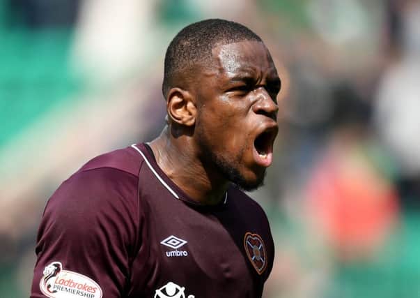 Uche Ikpeazu roars with delight after scoring the equalising goal for Hearts at Easter Road