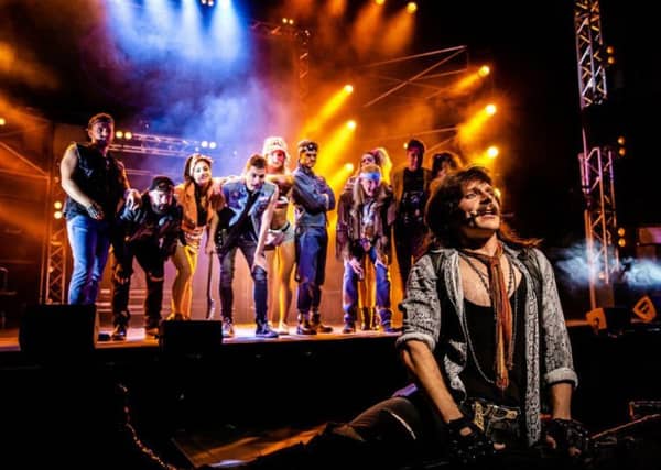 Lucas Rush as Lonny and the cast of Rock of Ages