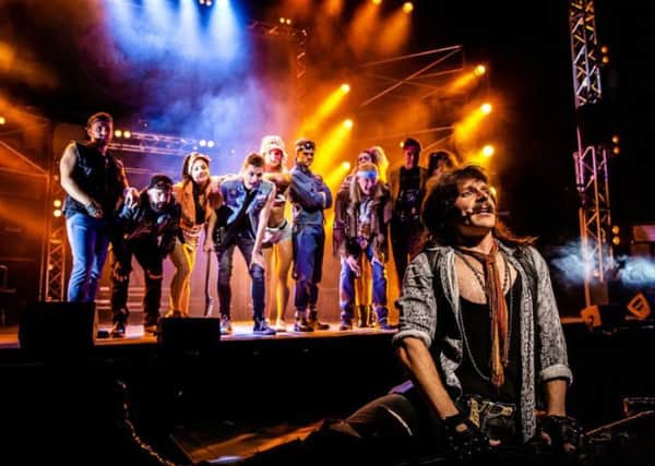 Lucas Rush as Lonny and the cast of Rock of Ages
