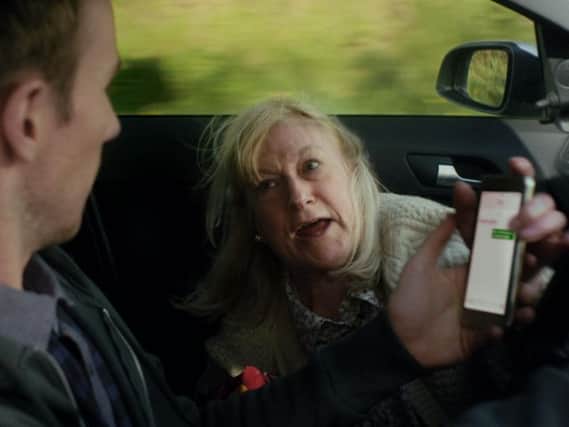 The driver's gran admonishes him for texting at the wheel