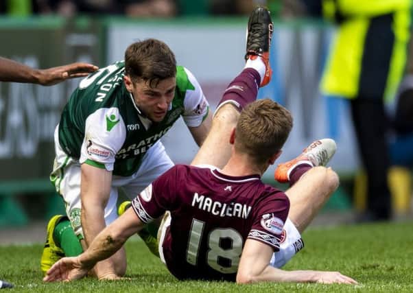 Hibs' Lewis Stevenson and Hearts' Steven MacLean clashed towards the end of last weekend's derby. Pic: SNS