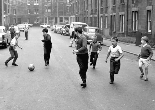 Boys play football in a virtually car-free Orwell Place in Dalry in 1966. Will we see a return to such scenes tomorrow?